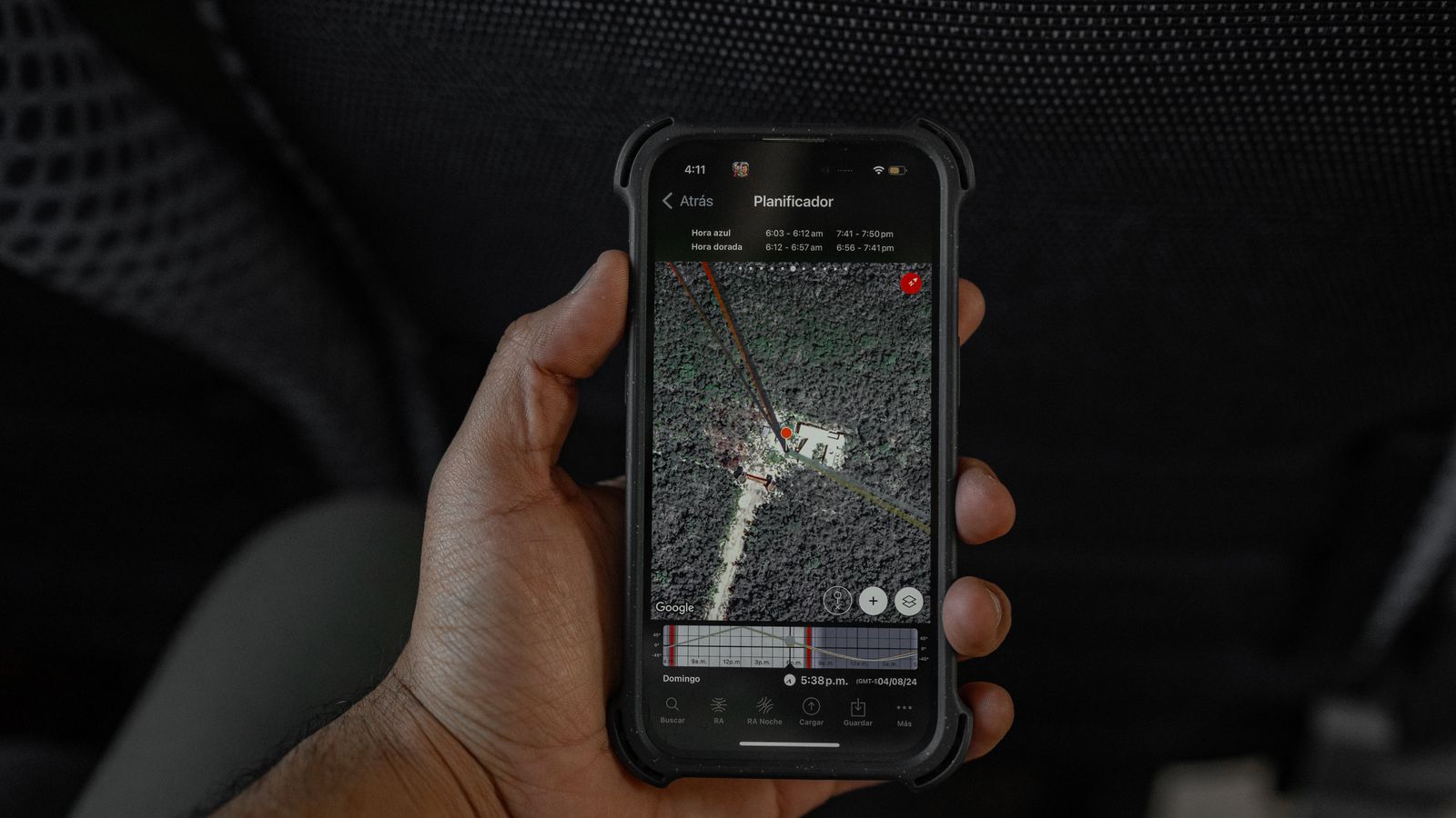 hand holding a smartphone displaying a GPS navigation map inside a vehicle, representing service-area coverage for location-based SEO pages